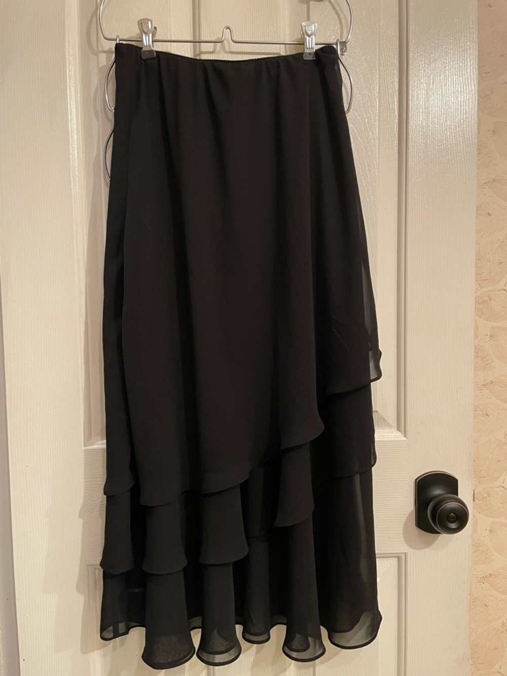 Black sheer maxi skirt with ruffles. Size: S